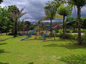 a group of playground equipment in a park at Taman Bukit Palem Resort in Bogor