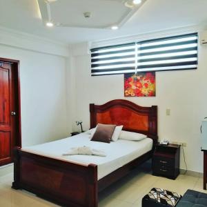 Postel nebo postele na pokoji v ubytování Hostal Perla Real Inn + 37 fotografií