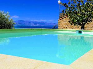 a swimming pool with a view of the ocean at Villa Verde in Cefalù