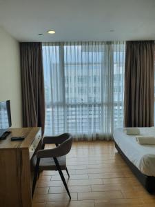 Postel nebo postele na pokoji v ubytování Bangi Perdana Hotel