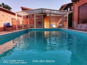 a swimming pool in front of a house at Villa Salvatore in San Leone