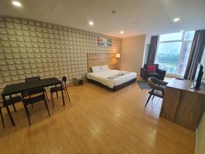 Postel nebo postele na pokoji v ubytování Bangi Perdana Hotel