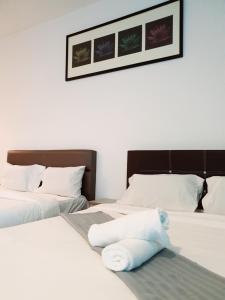 Postel nebo postele na pokoji v ubytování Bangi Perdana Hotel