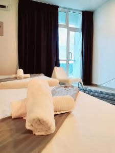 Postel nebo postele na pokoji v ubytování Bangi Perdana Hotel