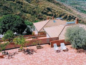 an aerial view of a house with two chairs and a patio at Villa Verde in Cefalù