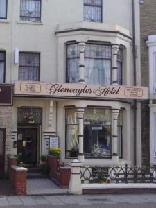 a store with a sign on the front of a building at Gleneagles - Albert Road in Blackpool