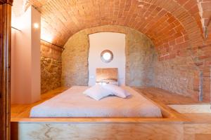 เตียงในห้องที่ Tognazzi Casa Vacanze - La Collina di San Gimignano