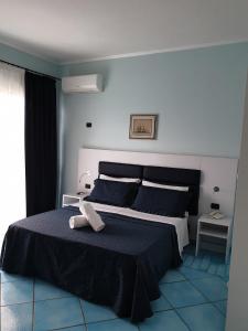 Кровать или кровати в номере L'Incanto Suites Ischia