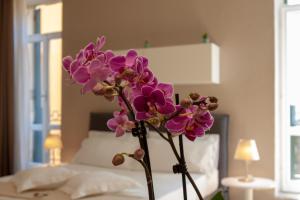 Posteľ alebo postele v izbe v ubytovaní Domus Suites Verona
