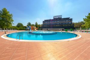 a large swimming pool in front of a building at Hilas Thermal Resort Spa & Aqua in Kayacık