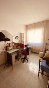 a living room with a desk and an umbrella at Matera Belvedere in Matera