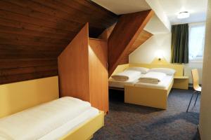 Voodi või voodid majutusasutuse Hotel Kreuz toas