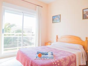 Ένα ή περισσότερα κρεβάτια σε δωμάτιο στο Apartamentos Canaret Punta Canaret Marineu Playa Romana