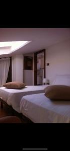 Кровать или кровати в номере Terrazzo sul mare