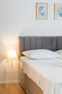 Posteľ alebo postele v izbe v ubytovaní Golden Luxury Apartment