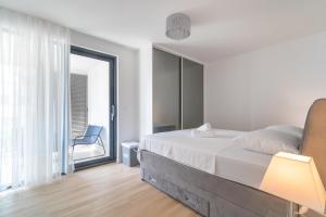Posteľ alebo postele v izbe v ubytovaní Golden Luxury Apartment
