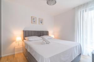 Posteľ alebo postele v izbe v ubytovaní Golden Luxury Apartment