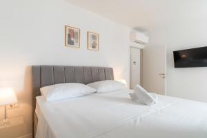 Posteľ alebo postele v izbe v ubytovaní Golden Luxury Apartment