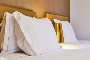 two white pillows on a bed in a room at Sintra Boutique Hotel in Sintra