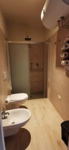 a bathroom with a toilet and a sink and a shower at Bed & Breakfast Cà Riccio in Macerata Feltria