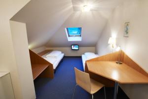 Voodi või voodid majutusasutuse Hotel Kreuz toas