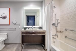 a bathroom with a sink and a shower and a toilet at Hyatt Centric Las Olas Fort Lauderdale in Fort Lauderdale