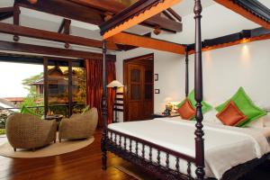 Postel nebo postele na pokoji v ubytování Angkor Village Hotel - Small Luxury Hotels of the World