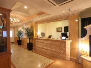 a lobby with a reception desk in a building at Hotel Fine Garden Nara Horai in Nara