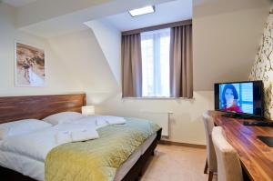 Posteľ alebo postele v izbe v ubytovaní Hotel Dobry Klimat
