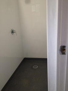 a room with a white door and a floor at Tui Glen in Raurimu Spiral