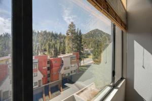 an open window with a view of a mountain at Large Spacious Upgraded 4 Bedroom Condo in Mammoth Lakes