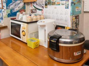 Kuchyň nebo kuchyňský kout v ubytování Tabist Business Ryokan Duck Ishinomaki Hebita