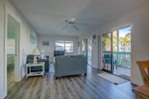 a living room with a couch and a table at Anna Maria Island Beach Palms 7A in Bradenton Beach