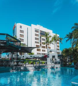 a swimming pool in front of a building at View Brisbane in Brisbane