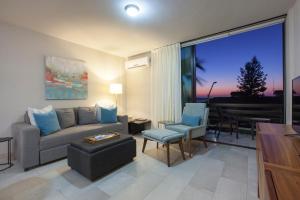 a living room with a couch and a table at Departamentos San José in La Paz