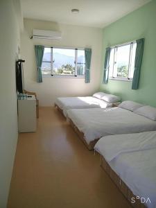 Una cama o camas en una habitación de Hao Homestay