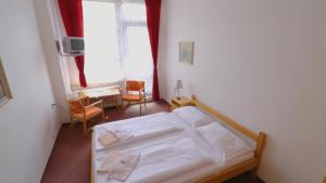 Posteľ alebo postele v izbe v ubytovaní Horský Hotel Neptun