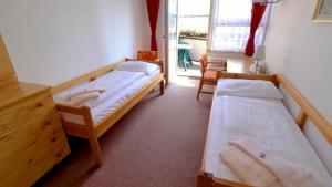 Posteľ alebo postele v izbe v ubytovaní Horský Hotel Neptun