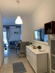Televízia a/alebo spoločenská miestnosť v ubytovaní Lucas Lux Flogita apartment