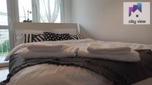 Posteľ alebo postele v izbe v ubytovaní CITY VIEW Zamenhofa + 4 fotografie
