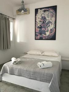 Un pat sau paturi într-o cameră la Naoussa Hotel Paros by Booking Kottas