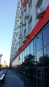 a building with glass windows on the side of it at Smart House 7 in Kyiv