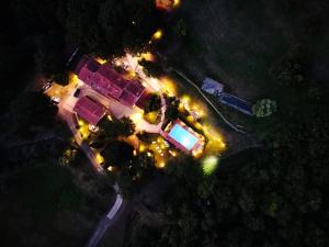 an overhead view of a house with lights at night at Agriturismo Pratofranco in Pontremoli