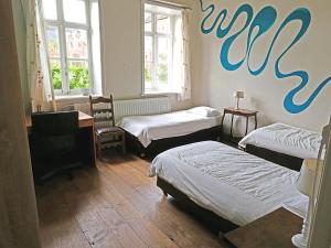 Кровать или кровати в номере Kasteel Nieuwenhoven