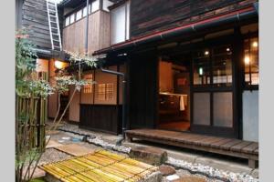 a building with the entrance to a building with a porch at Onoan in Hida