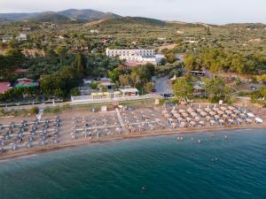 an aerial view of a beach with umbrellas and the water at Klio Hotel in Alexandroupoli