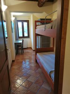 Postel nebo postele na pokoji v ubytování Podere Serena