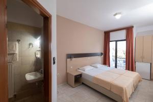 Postel nebo postele na pokoji v ubytování Klio Hotel