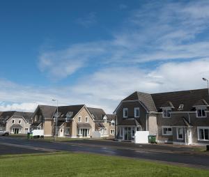 a row of houses on a street at 18A Moore Bay Holiday Homes by Trident Holiday Homes in Kilkee