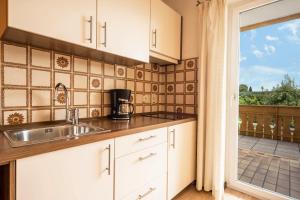 A kitchen or kitchenette at Residence Kronstein - Fewo 2